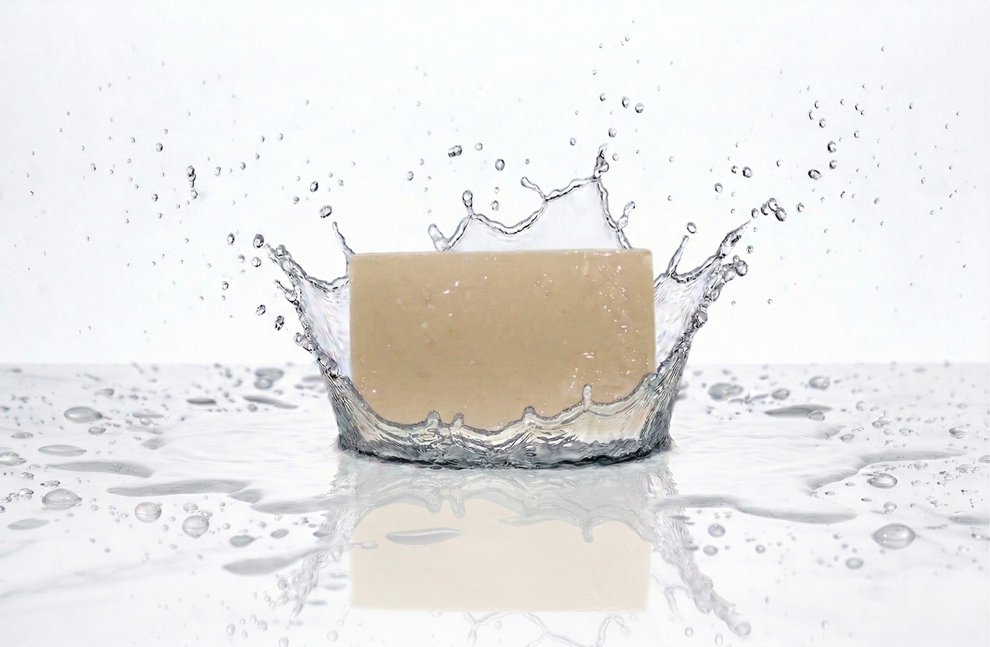 Facial Bar of soap with water splashes on a white background