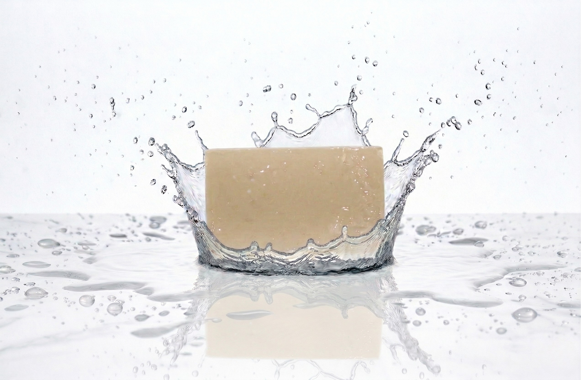 Facial Bar of soap with water splashes on a white background