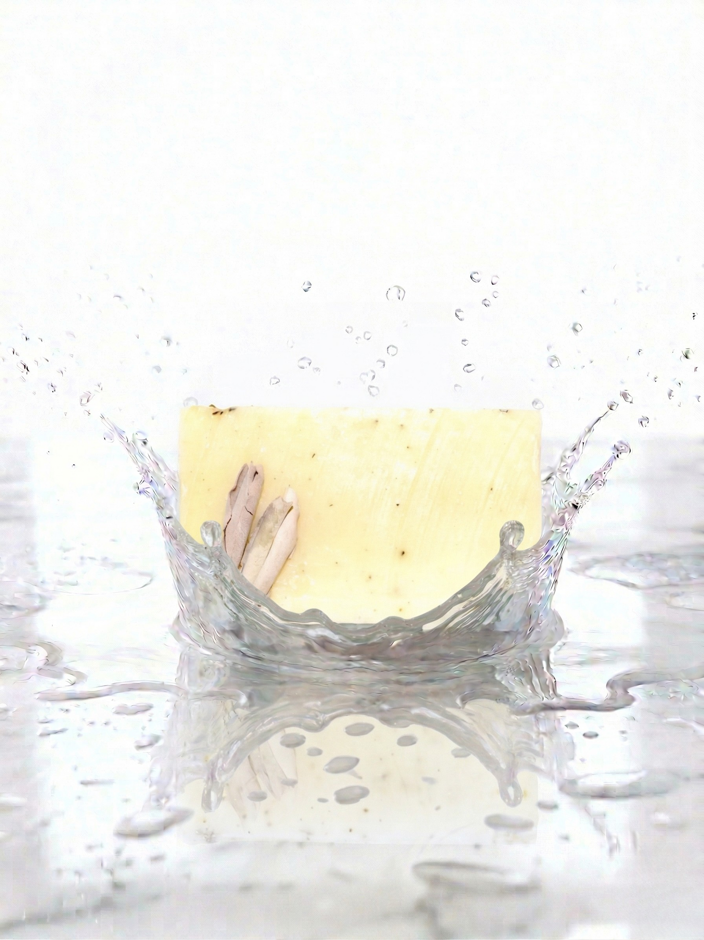 Creamy coloured soap 
with water splashes.
