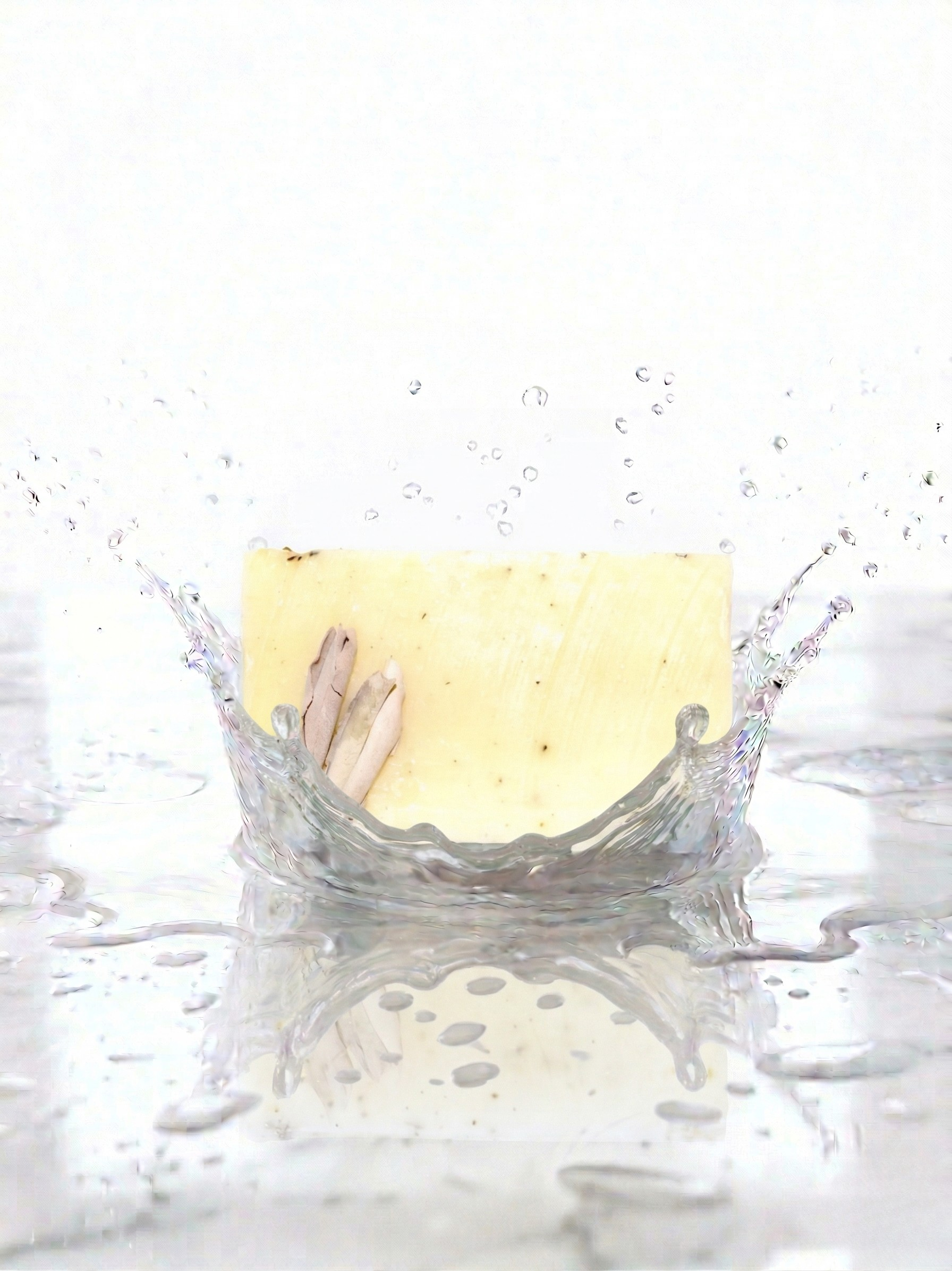Creamy coloured soap 
with water splashes.